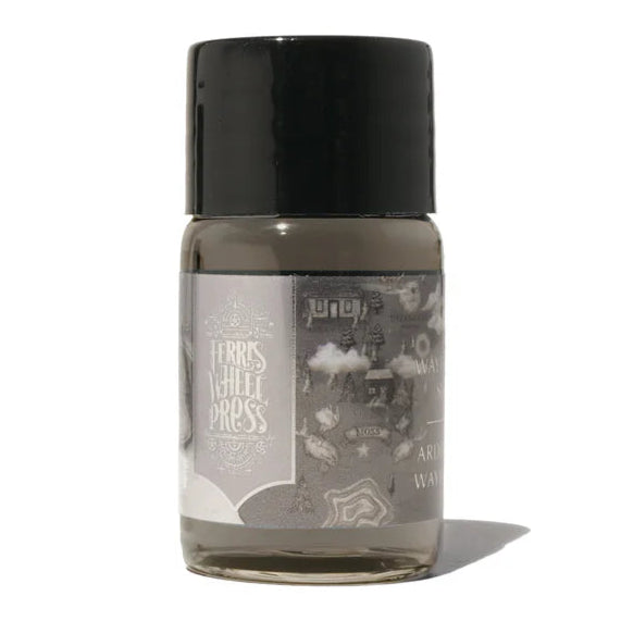 Small bottle with a black cap on a white background