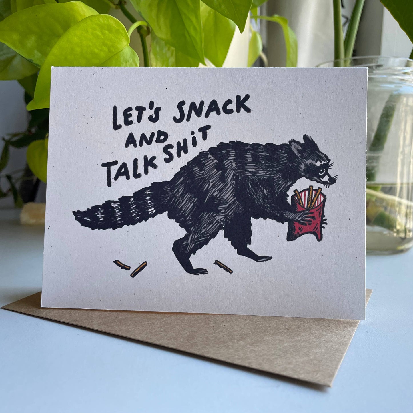 Kendra Lee Miller Art - Let’s Snack and Talk Shit Raccoon Greeting Card