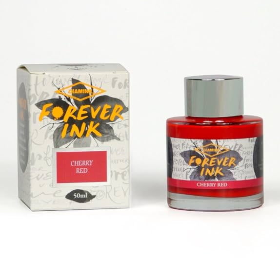Bottle and box of Forever Ink Cherry Red on a white background