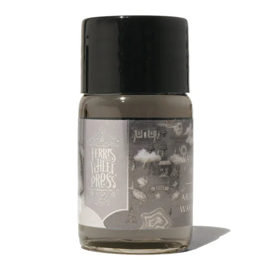 Small bottle with a black cap on a white background