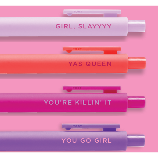 Set of four pens in different colors with motivational text on a pink background