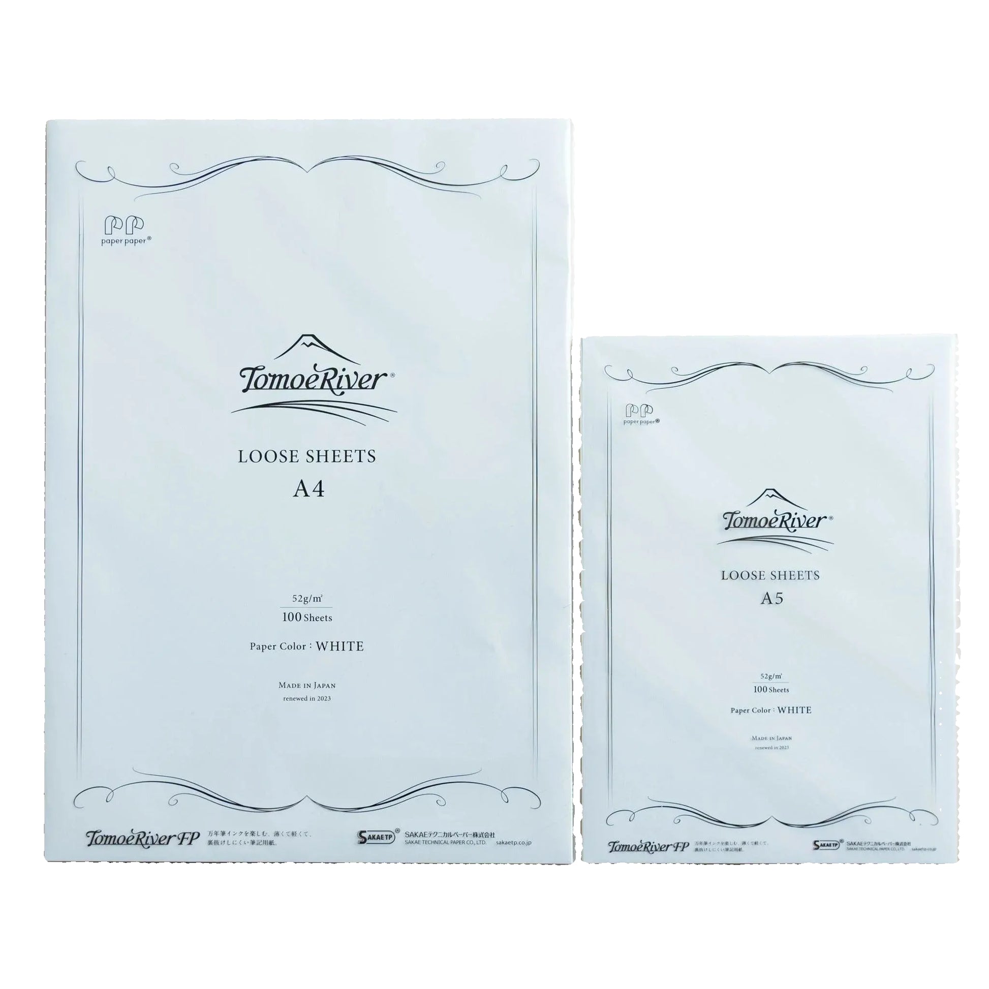 Two packages of Tomoe River loose sheets on a white surface
